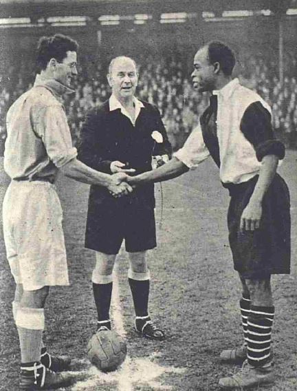 Oxford and Cambridge captains shake hands before game at Dulwich Hamlet.